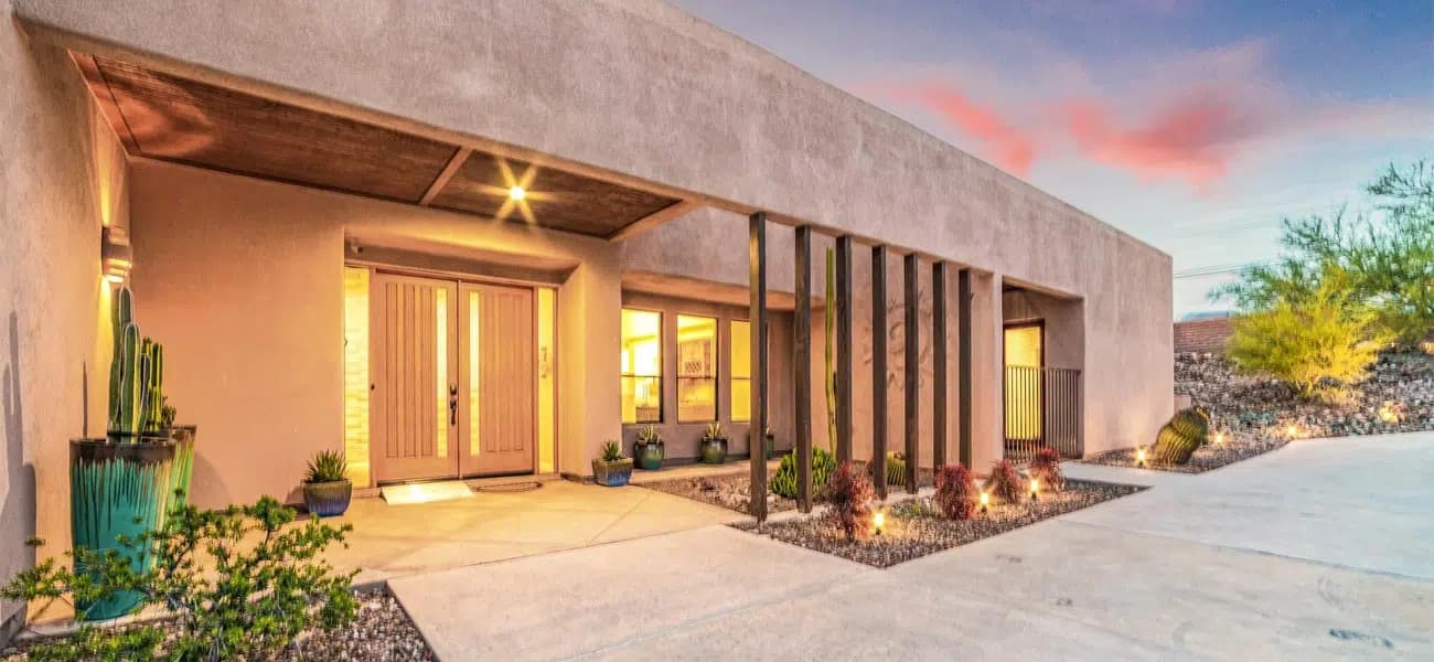 A Sonoran-style adobe home at dusk in Tucson, Arizona